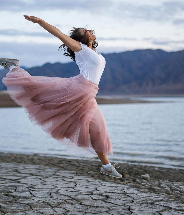 Woman feeling energetic and happy outdoors.